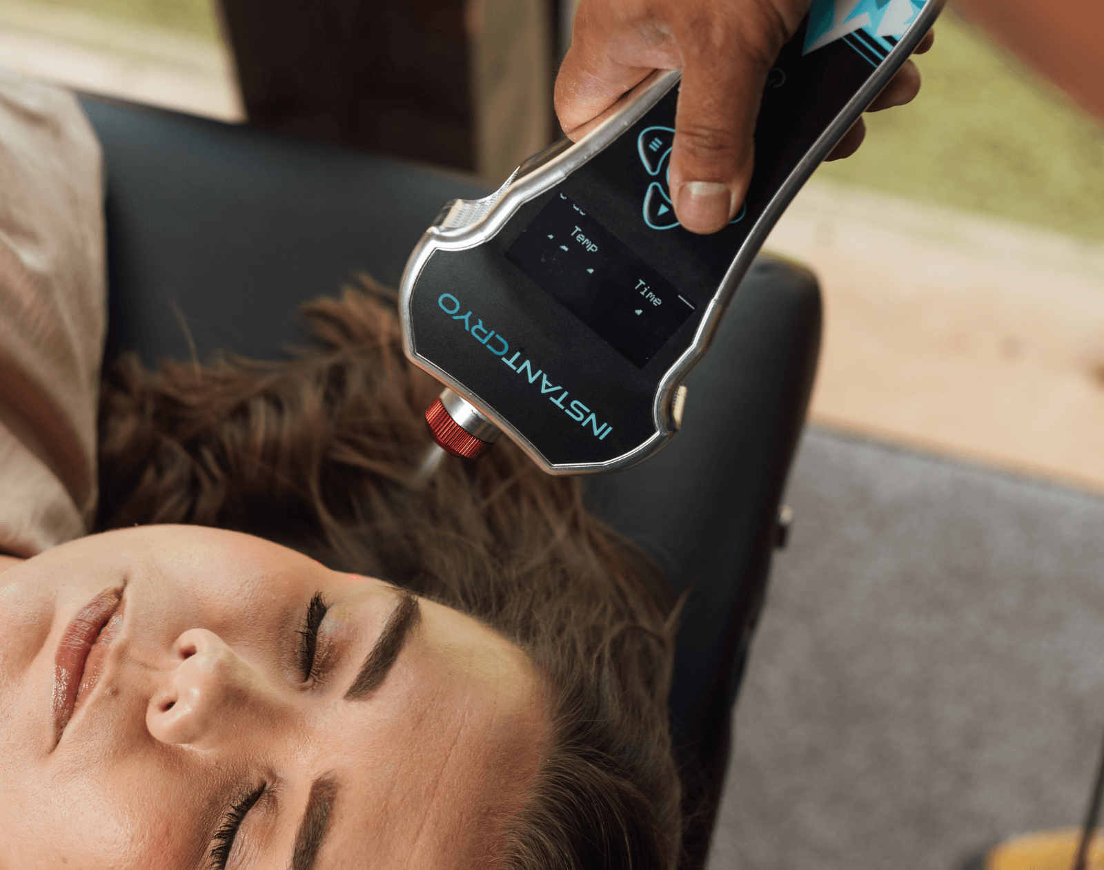 A localized cryotherapy treatment is applied to the face for improved skin health.